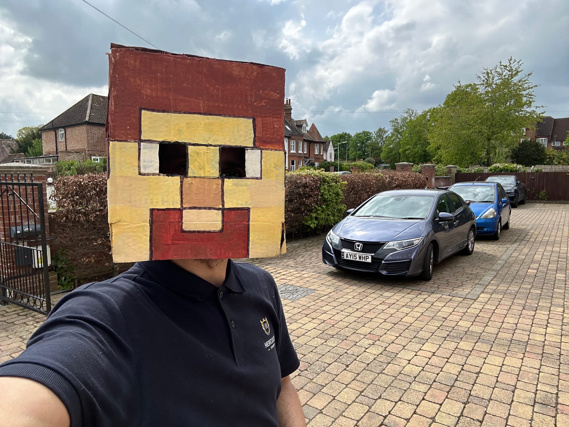 Hercules team member with cardboard mascot head